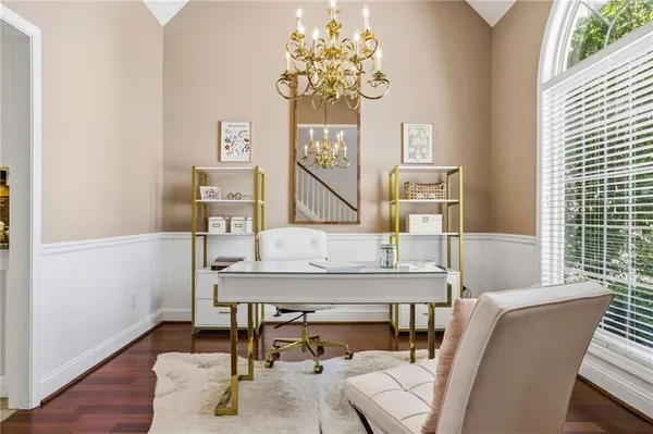 a view of a dining room with furniture and wooden floor