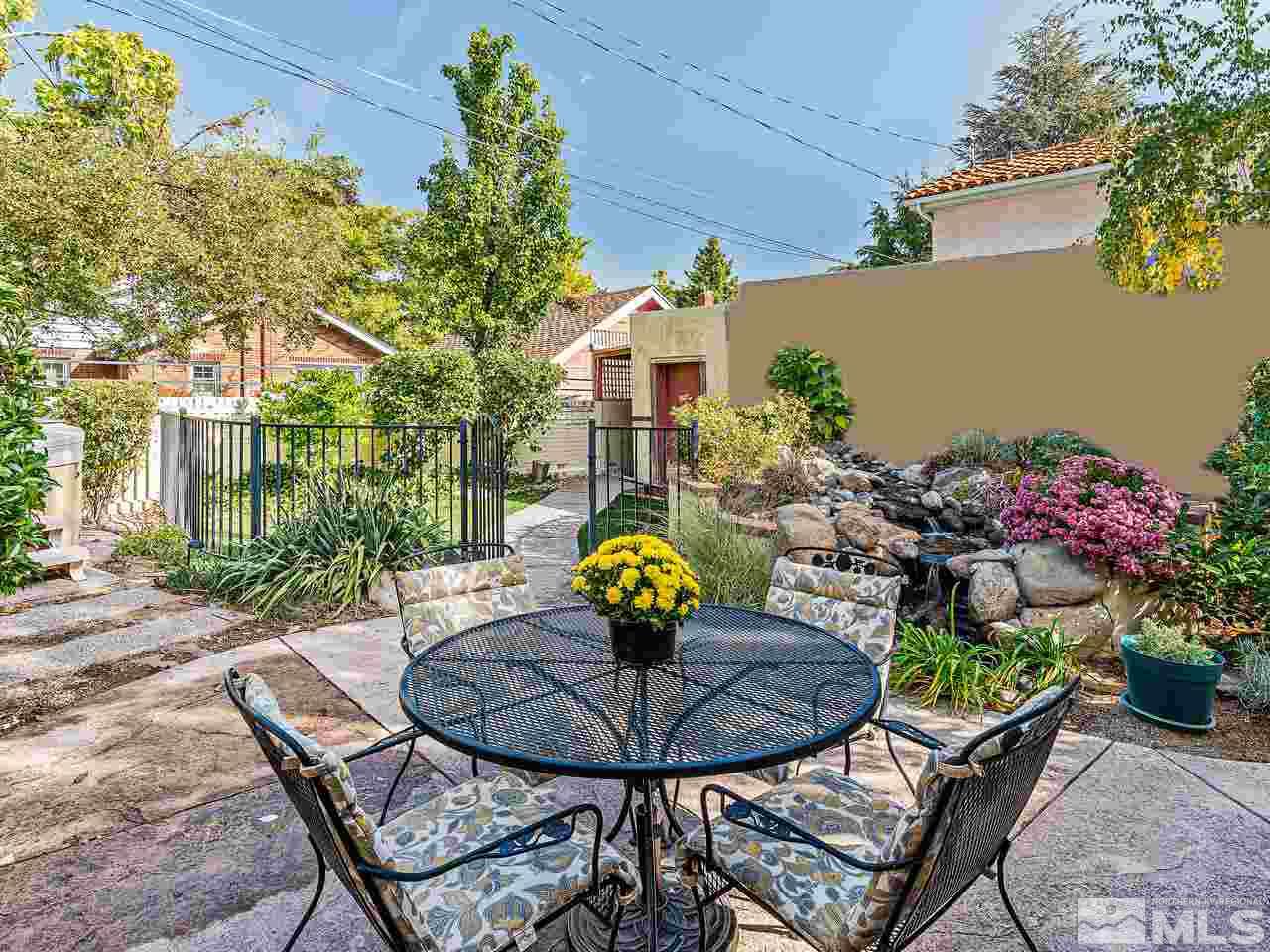 885 La Rue Avenue Reno, NV 89509 - Photo 12 of 18 a view of a chairs and table in backyard