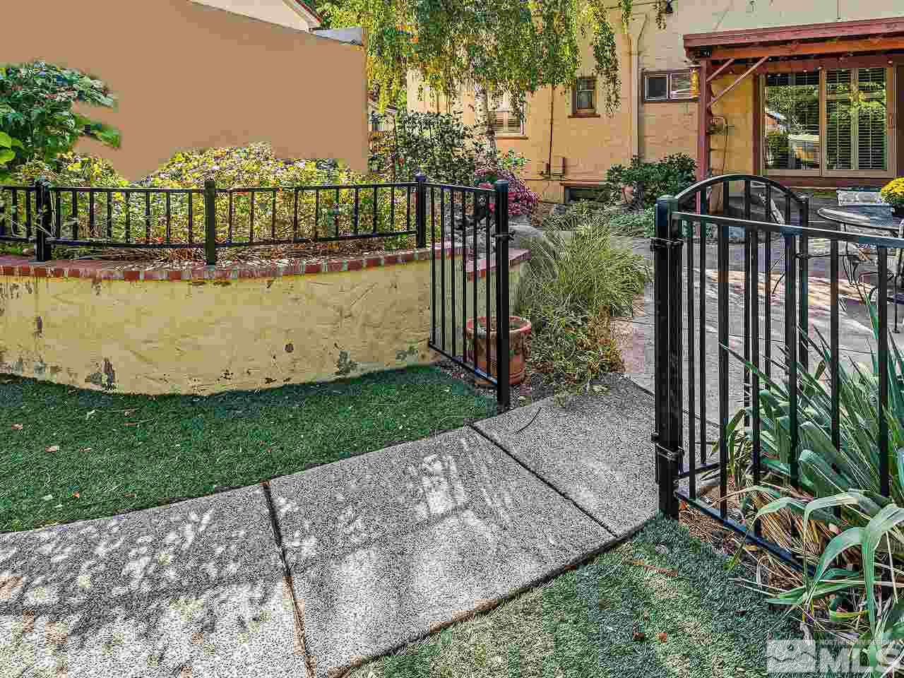 885 La Rue Avenue Reno, NV 89509 - Photo 14 of 18 a view of a house with a small yard and wooden fence