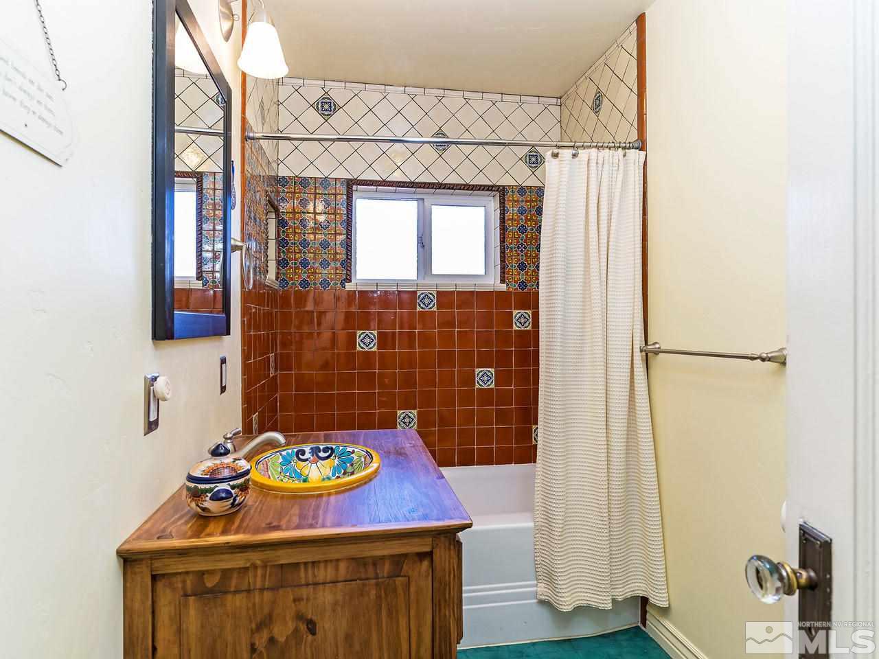 885 La Rue Avenue Reno, NV 89509 - Photo 9 of 18 a bathroom with a sink toilet and mirror