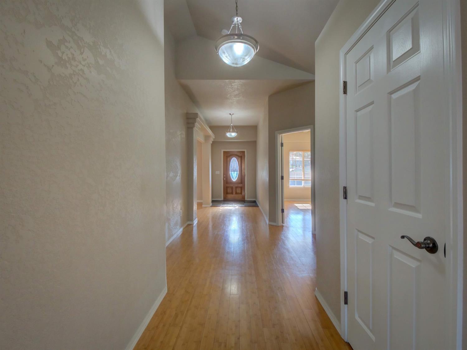 1535 Ridge Way Medford, OR 97504 - Photo 2 of 23 Main hallway, with bamboo flooring.