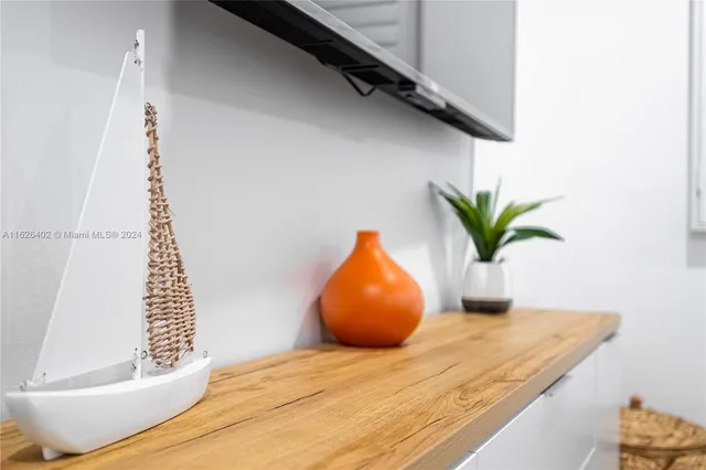 a bedroom with a bed and a potted plant