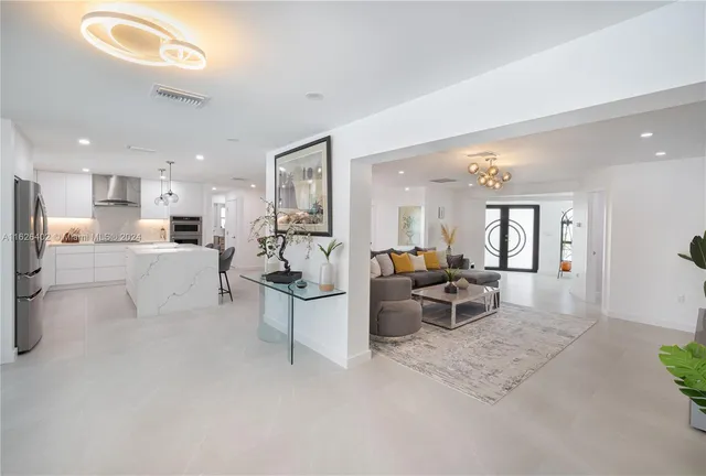 a living room with furniture white walls and white walls
