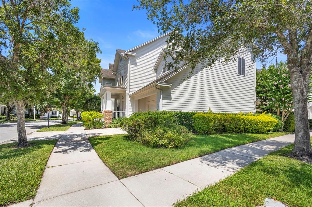 907 Pawstand Road Celebration, FL 34747 - Photo 5 of 49 a front view of a house with a yard and trees