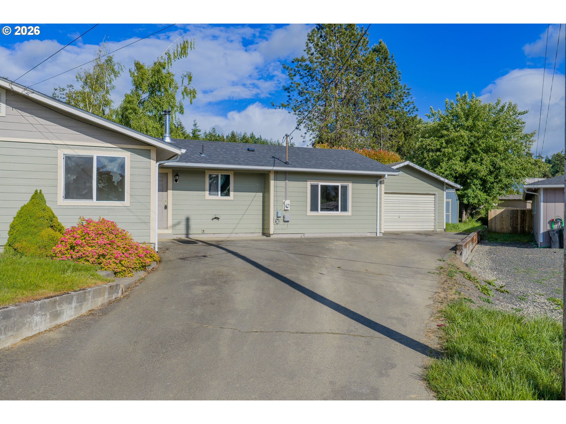 1816 Sunset Court Myrtle Point, OR 97458 - Photo 2 of 42 a view of a house with a yard