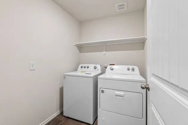 a utility room with dryer and washer