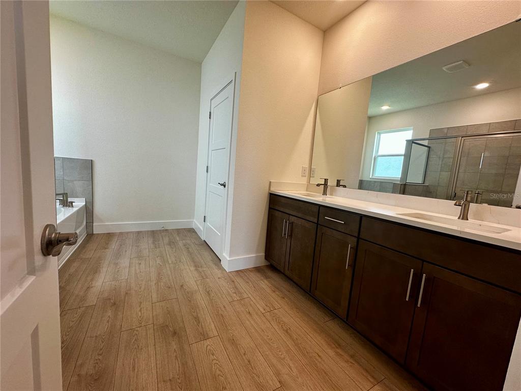 4281 Southwest 52nd Lane Road Ocala, FL 34474 - Photo 23 of 26 a bathroom with a sink mirror and view