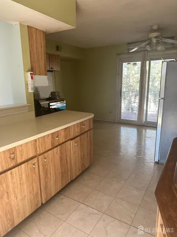 a kitchen with sink cabinets and window