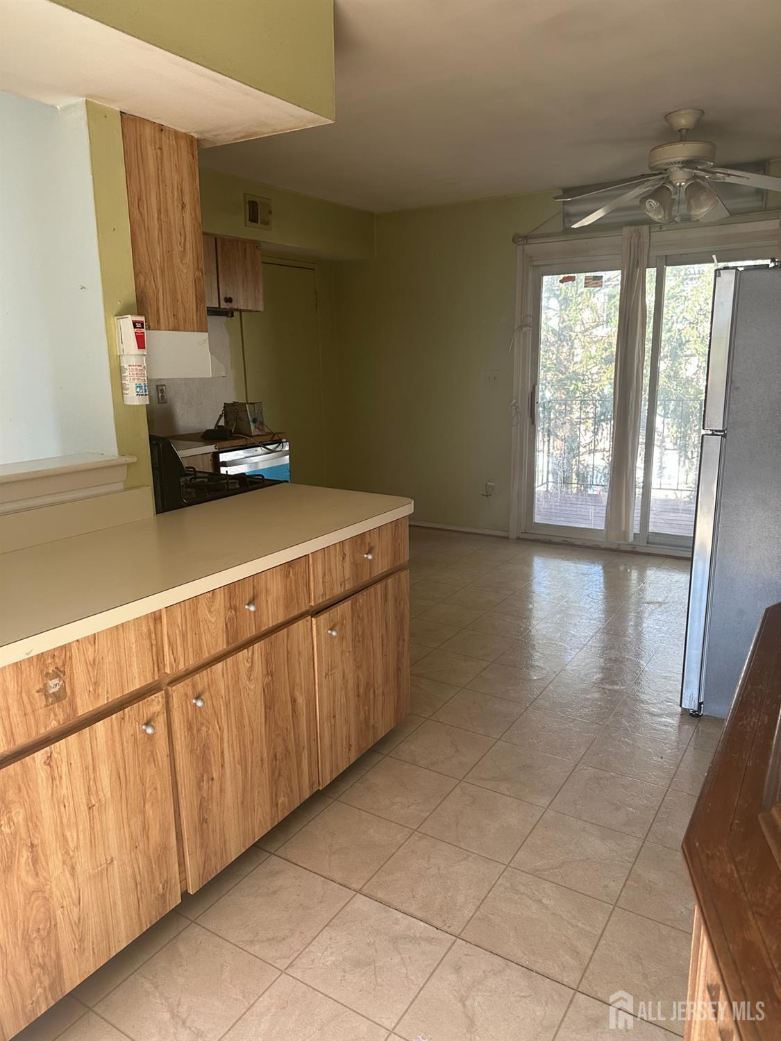 a kitchen with sink cabinets and window