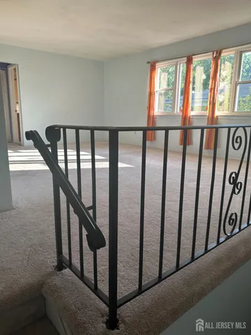 a view of staircase with lots of windows