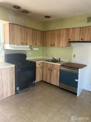 a kitchen with a sink and cabinets