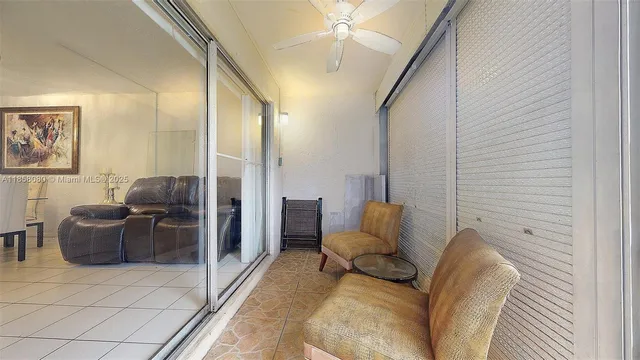 a car parked in front of a brick house next to a yard