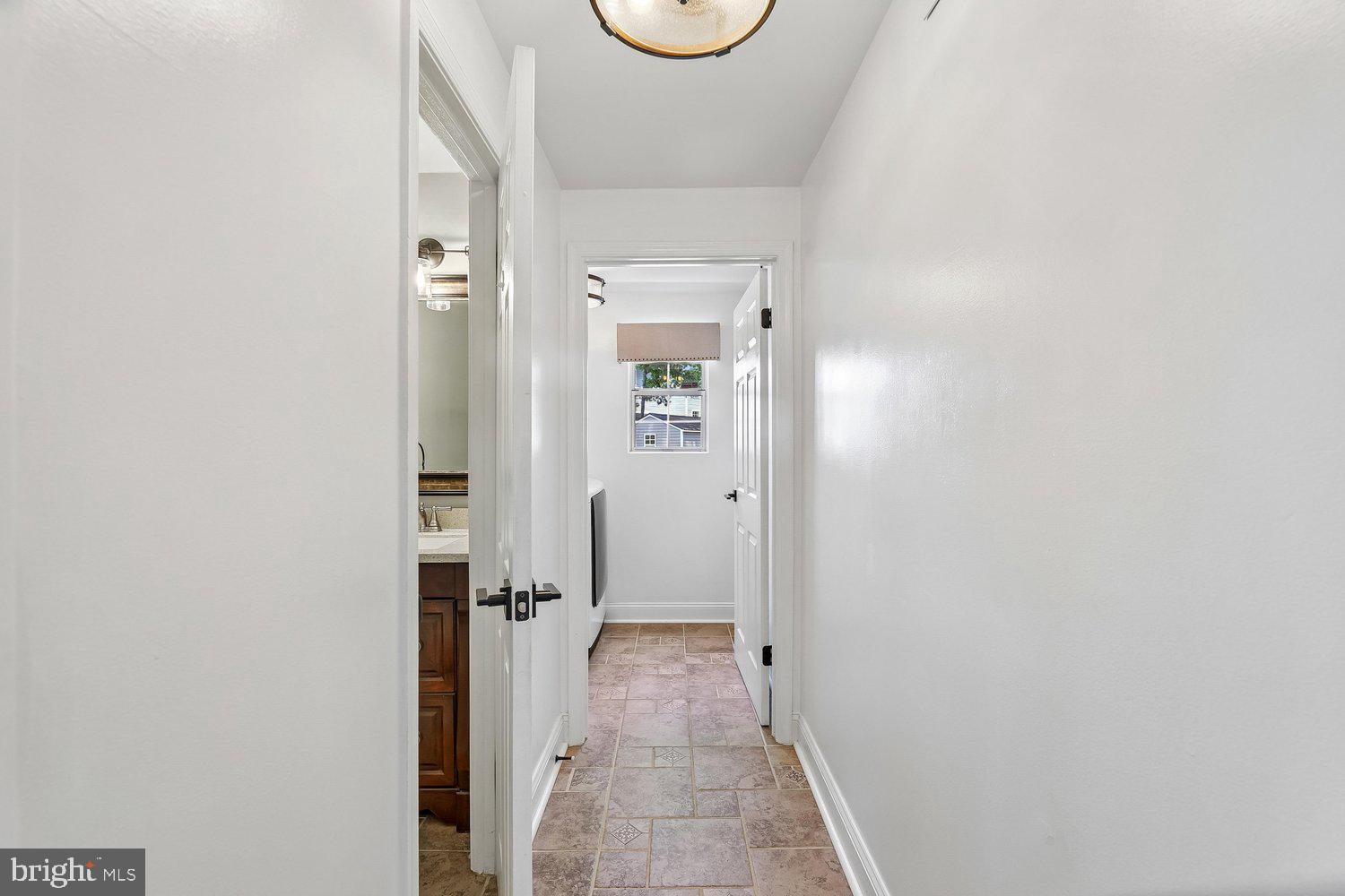 15764 Beau Ridge Drive Woodbridge, VA 22193 - Photo 16 of 58 a view of a hallway with wooden floor