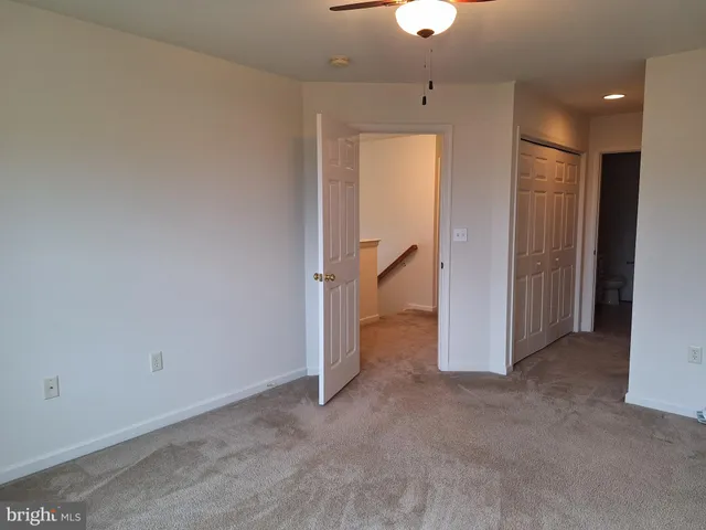 an empty room with a bathroom