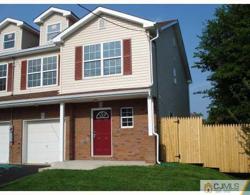 10 Edwin Street Carteret, NJ 07008 - Photo 1 of 10 a front view of a house with a yard