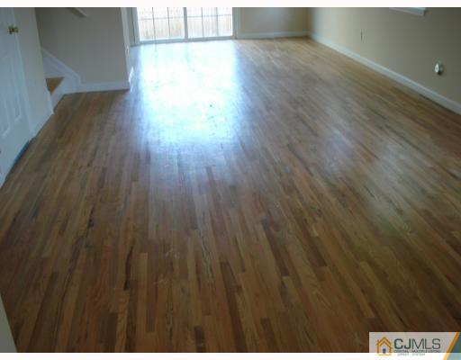10 Edwin Street Carteret, NJ 07008 - Photo 2 of 10 a view of an empty room with wooden floor
