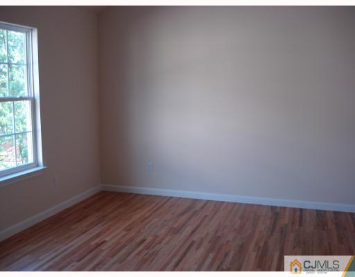 10 Edwin Street Carteret, NJ 07008 - Photo 7 of 10 a view of an empty room and window