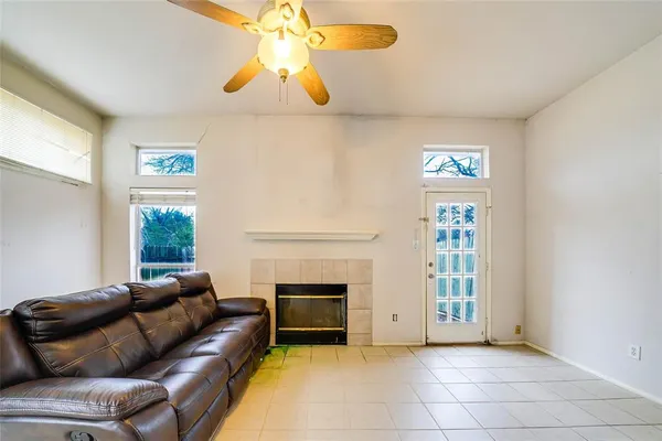 a living room with furniture and a fireplace