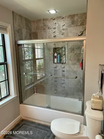 a bathroom with a bathtub toilet and sink