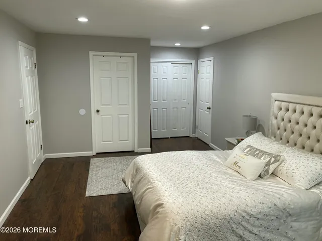 a bedroom with a bed and a walk in closet