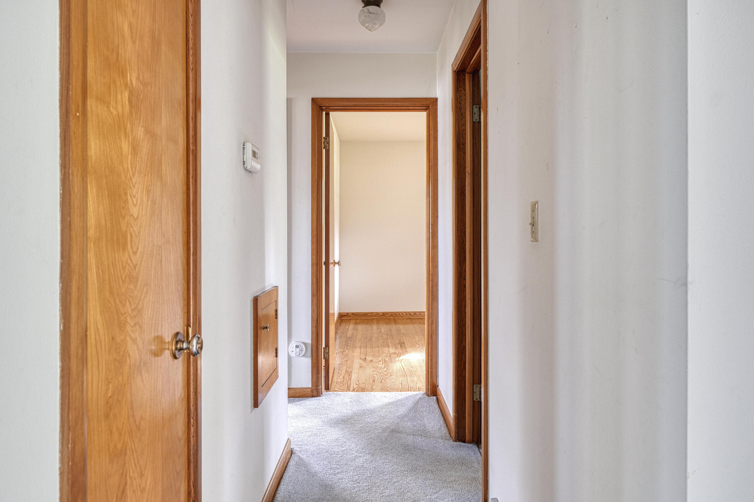W139N6995 Bay Ridge Lane Menomonee Falls, WI 53051 - Photo 20 of 28 Hallway to Bedrooms
