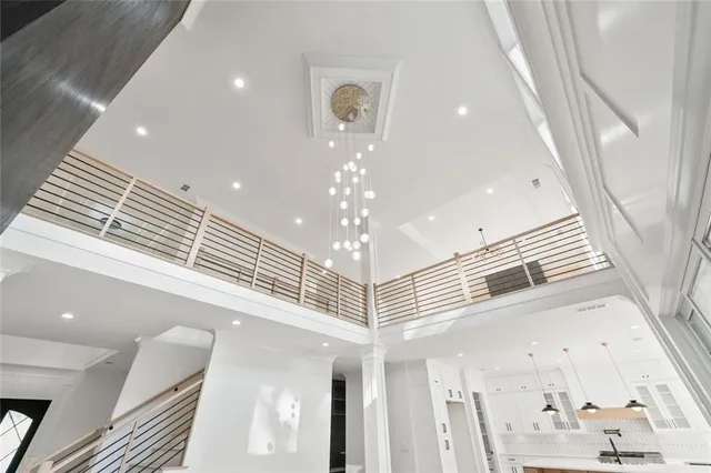 a kitchen with stainless steel appliances kitchen island granite countertop a sink a stove and a refrigerator