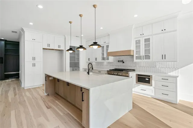 a kitchen with counter top space and appliances