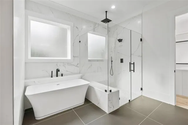 a room with a bed and a flat screen tv