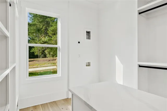 a white toilet sitting next to a bathroom sink