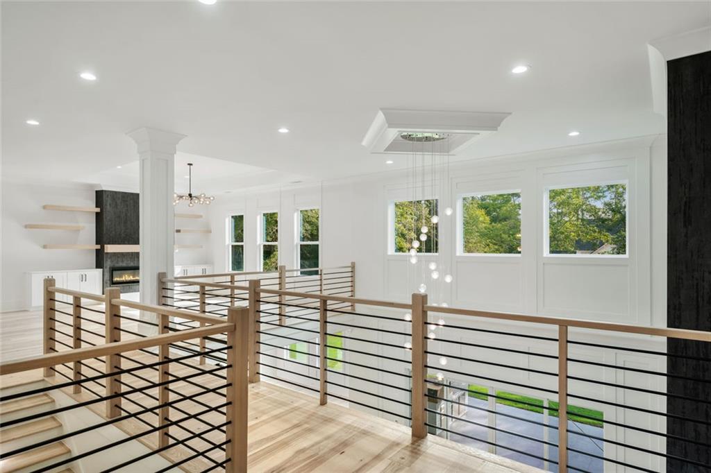 876 Bramlett Shoals Road Lawrenceville, GA 30045 - Photo 31 of 64 a view of a living room and kitchen with wooden floor