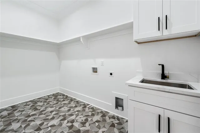 an aerial view of a house with garden space and street view