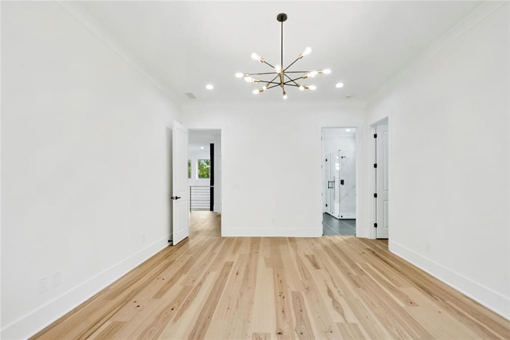876 Bramlett Shoals Road Lawrenceville, GA 30045 - Photo 49 of 64 a view of empty room with wooden floor