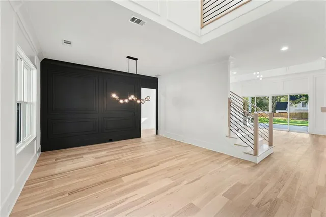 a view of empty room with window and entryway