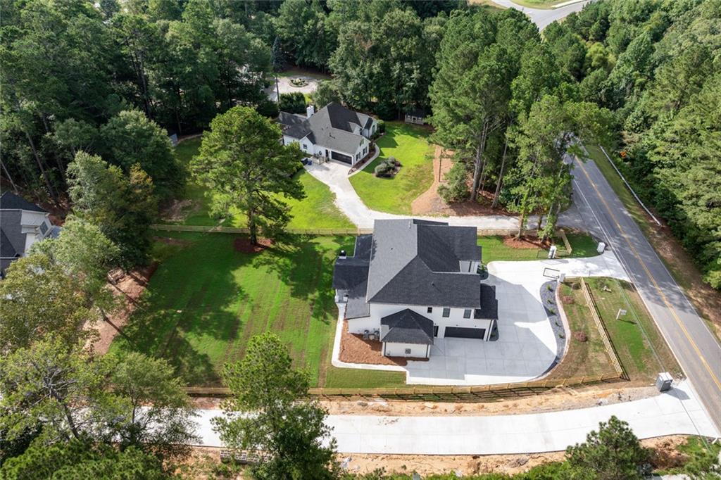 876 Bramlett Shoals Road Lawrenceville, GA 30045 - Photo 63 of 64 an aerial view of a house with outdoor space pool seating area and yard