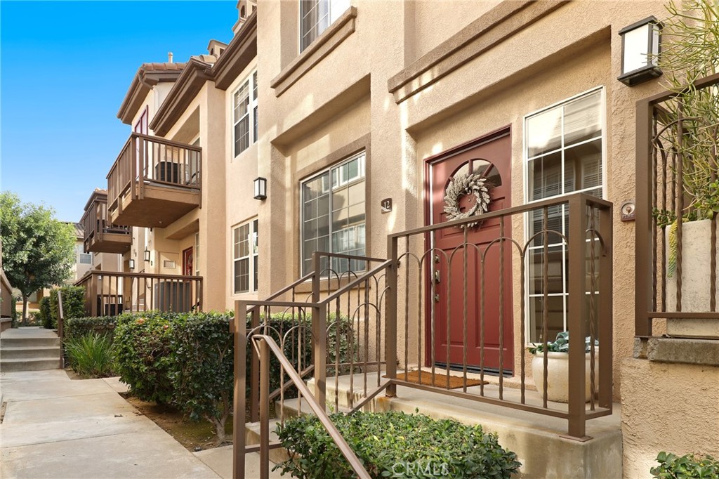 12 Montana Del Lago Drive, Unit 168 Rancho Santa Margarita, CA 92688 - Photo 19 of 23 a view of a brick building with large windows