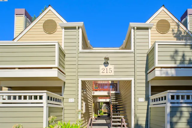 a view of a door of the house with a roof deck