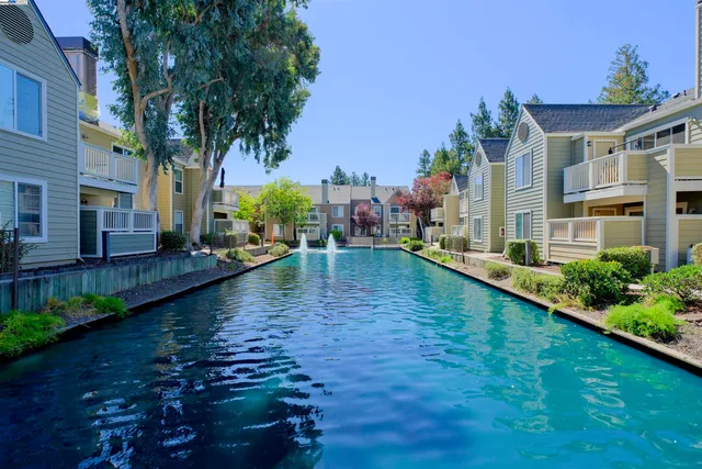 a view of a lake with a house in the background