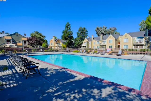 a view of swimming pool with outdoor seating