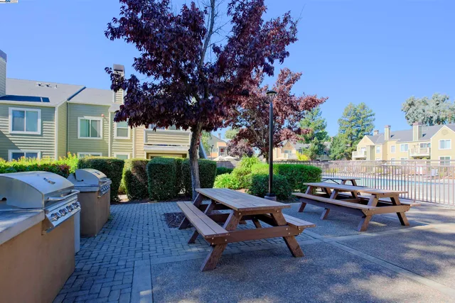 a backyard of a house with outdoor seating