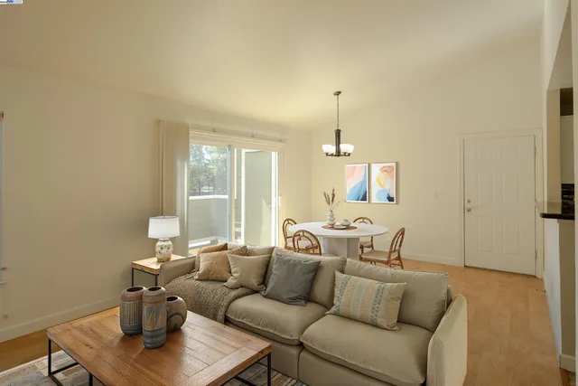 a living room with furniture and a table