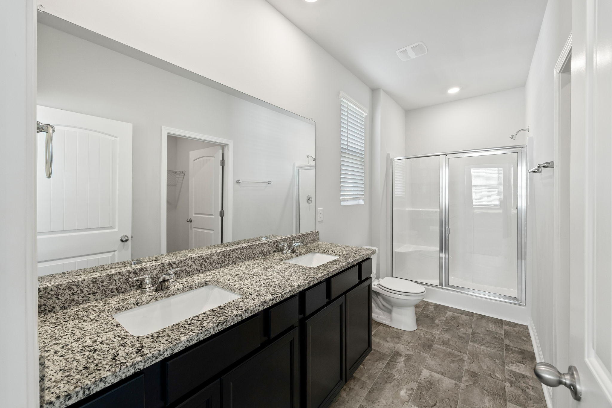 312 Oliver Way Baxter, TN 38544 - Photo 12 of 33 a bathroom with a granite countertop sink and a mirror