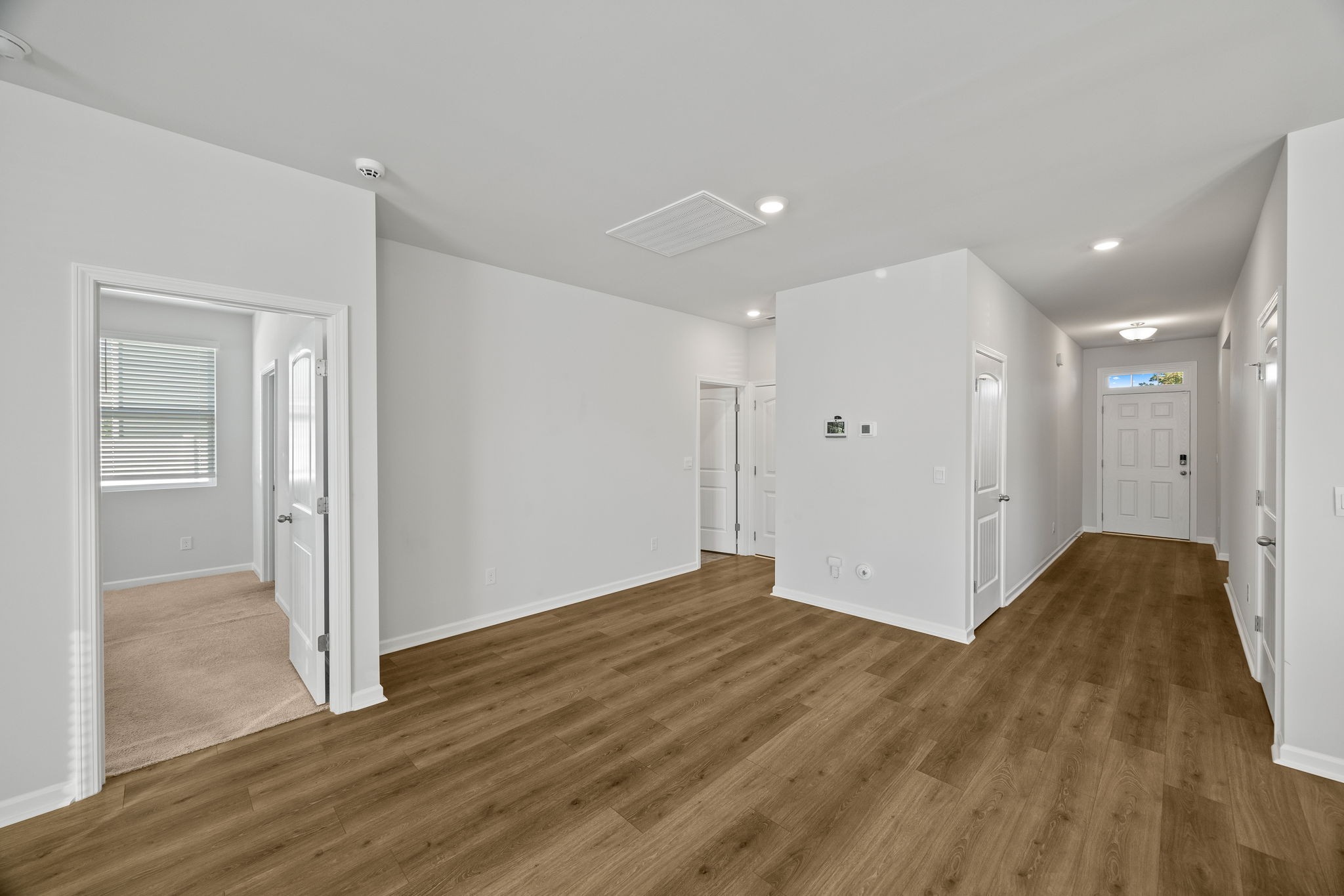 312 Oliver Way Baxter, TN 38544 - Photo 14 of 33 a view of a big room with wooden floor and a bathroom