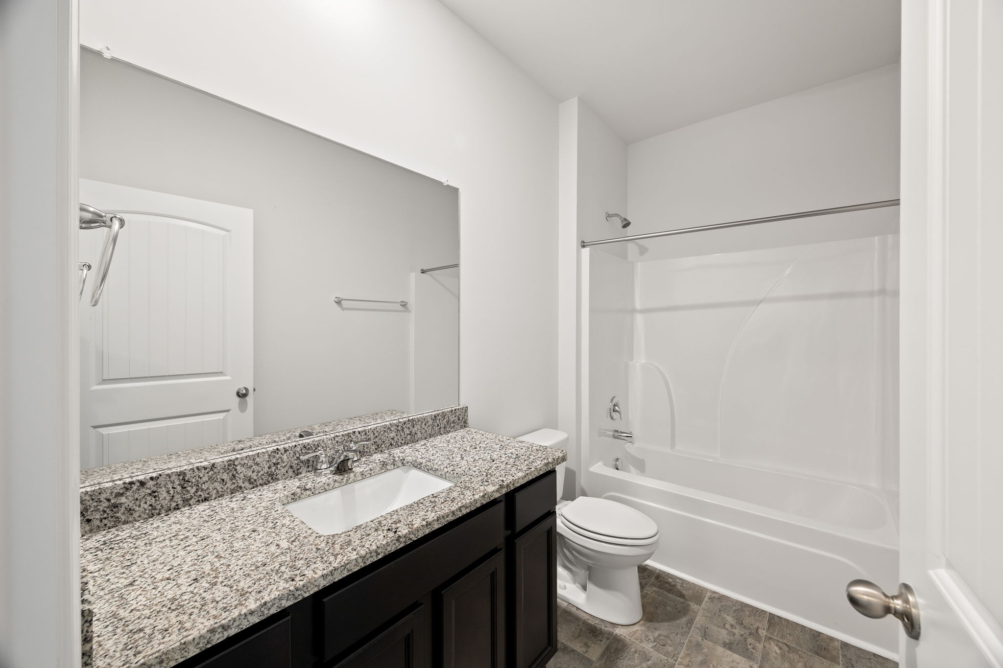 312 Oliver Way Baxter, TN 38544 - Photo 19 of 33 a bathroom with a granite countertop sink toilet and shower