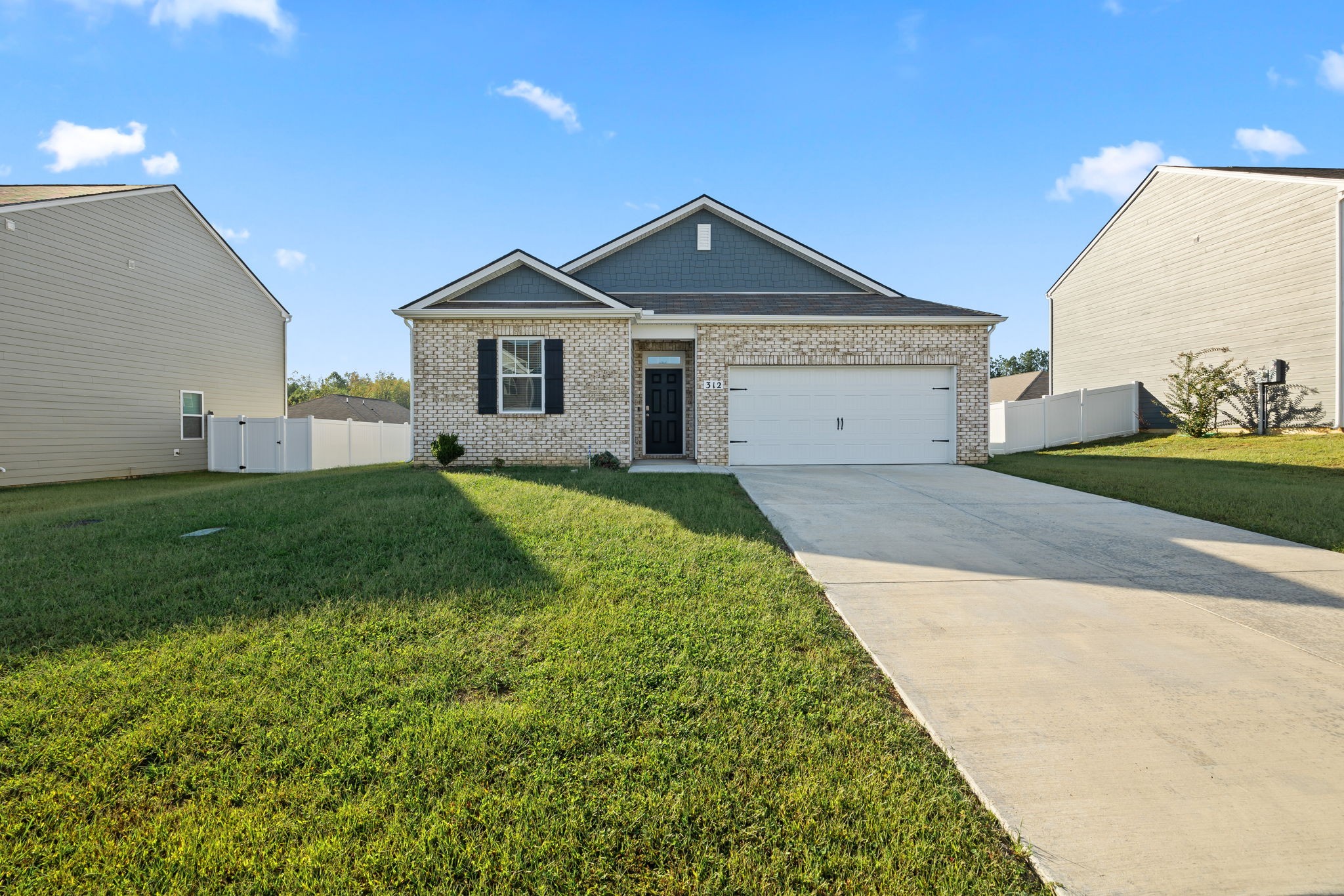 312 Oliver Way Baxter, TN 38544 - Photo 22 of 33 a view of a front of house with a yard