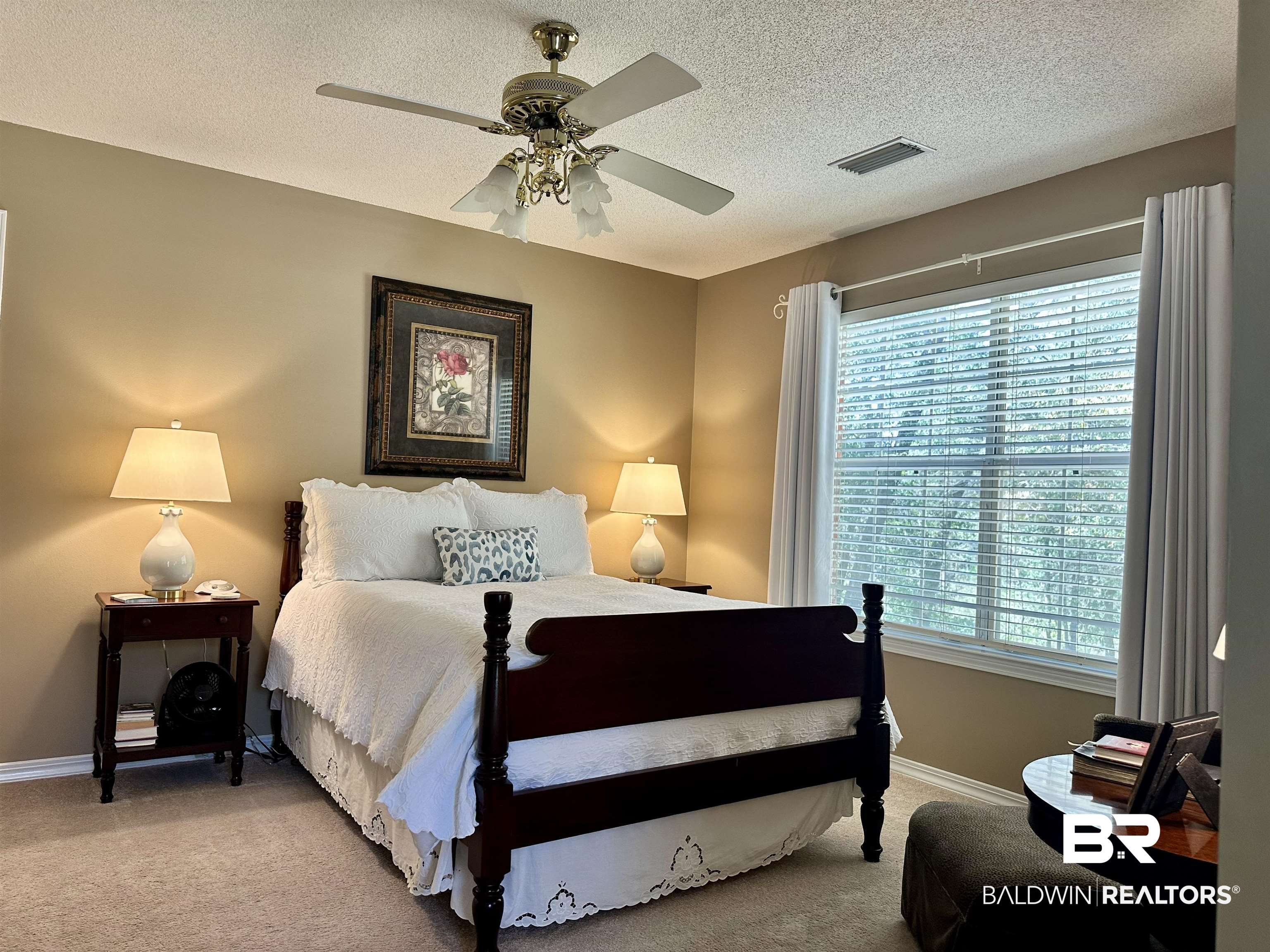 148 Brooks Boulevard Brewton, AL 36426 - Photo 29 of 45 Bedroom featuring visible vents, light carpet, a textured ceiling, and ceiling fan
