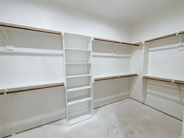 a view of an empty walk in closet