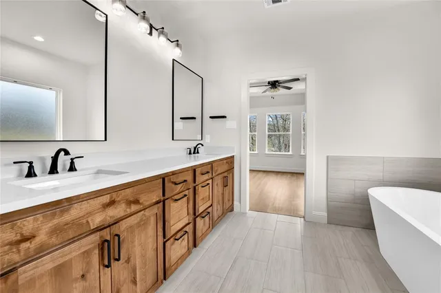 a white bath tub sitting in a bathroom