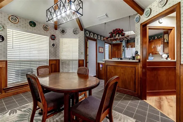 a view of a dining area with furniture window and wooden floor