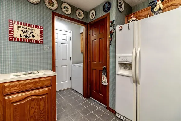 a kitchen with stainless steel appliances a sink stove and cabinets