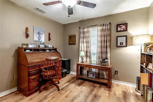 a view of a livingroom with furniture and windows